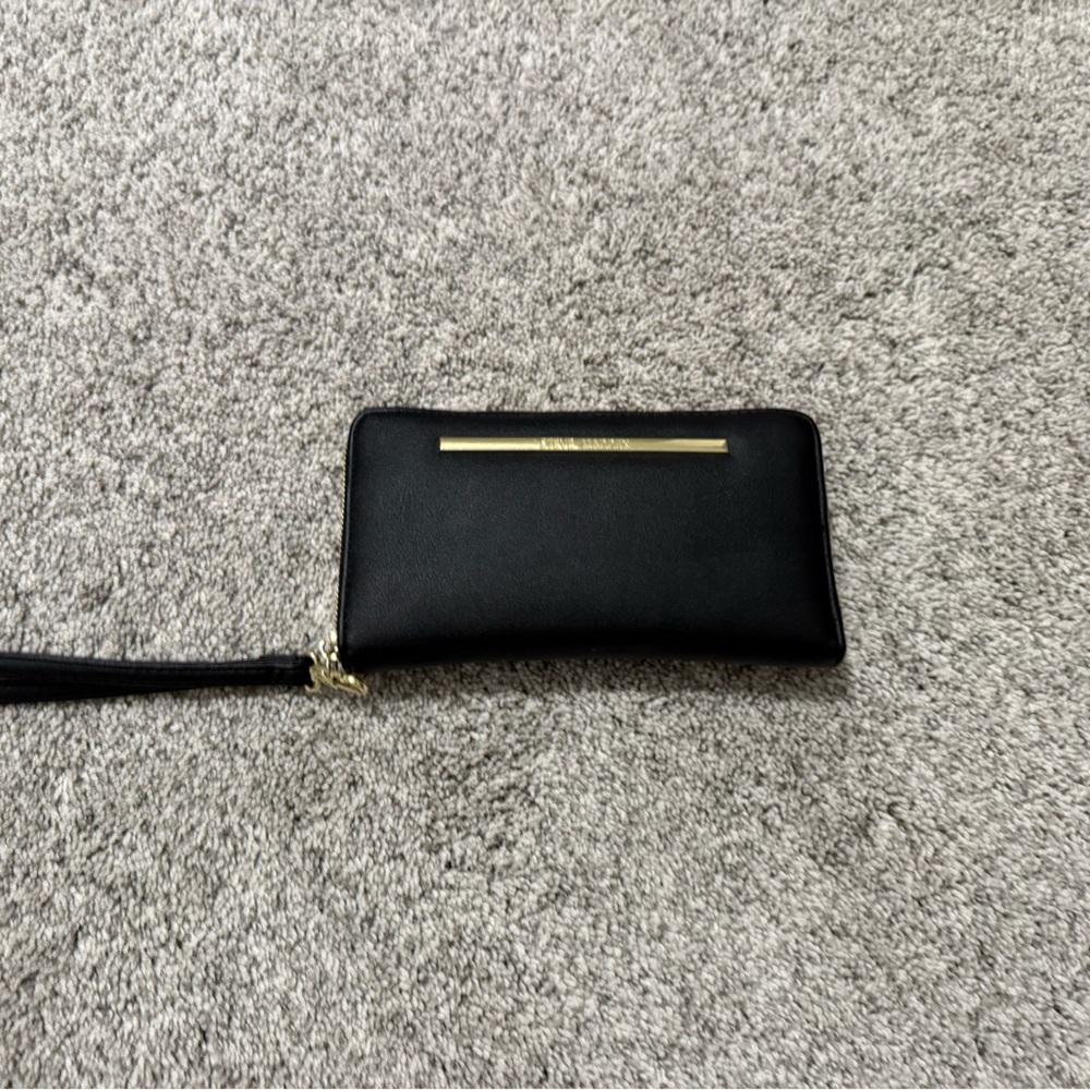 Black and gold Steve Madden wristlet